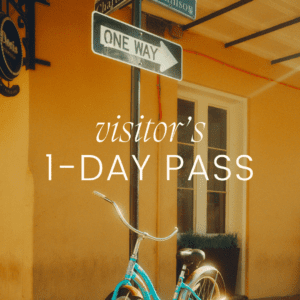 Bicycle by building with visitor's pass text.