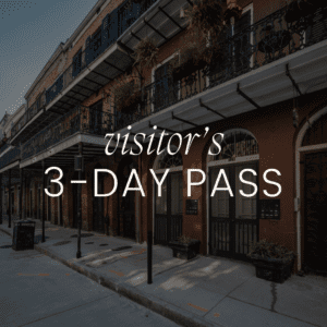 Visitor's 3-day pass with historic building background.
